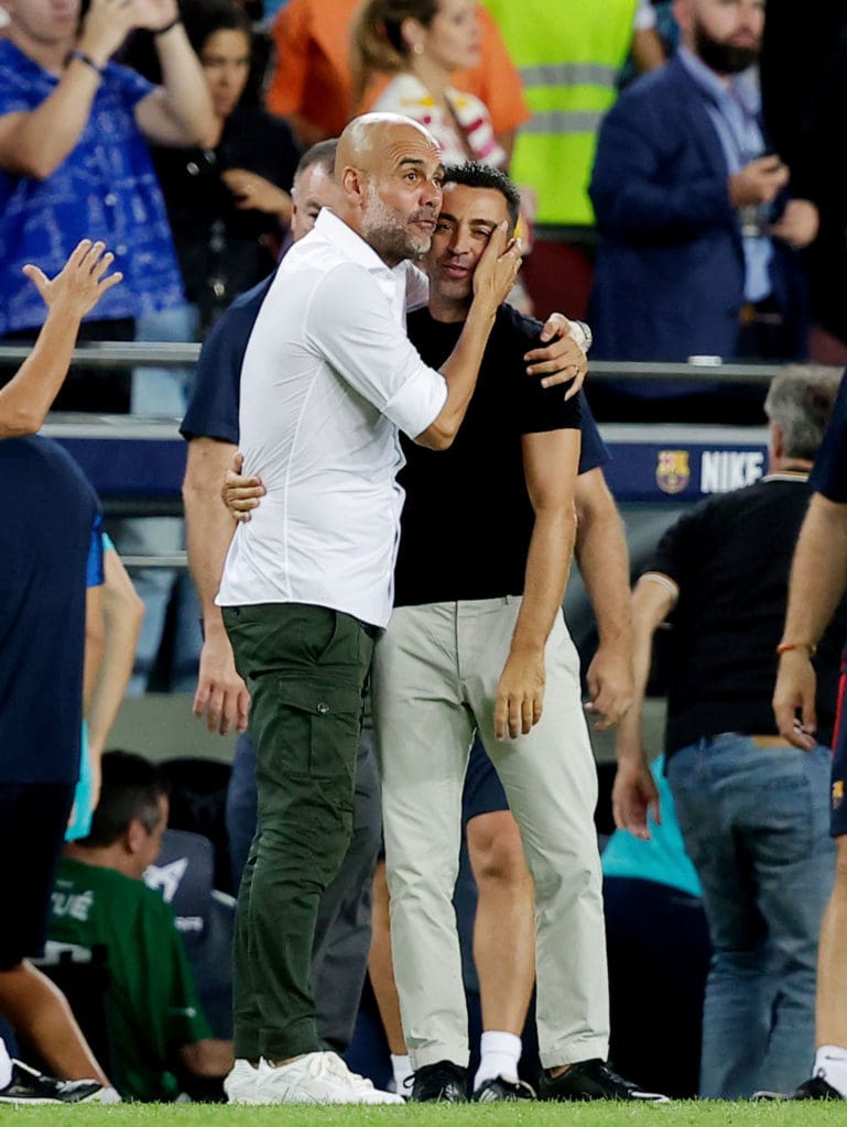 Pep Guardiola y Xavi Hernández