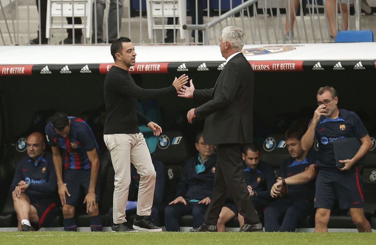 Xavi y Carlo Ancelotti